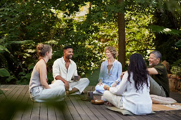 Small community wellness group meeting outdoors